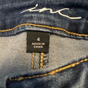 Inc mid rise jeans with fringe bottom